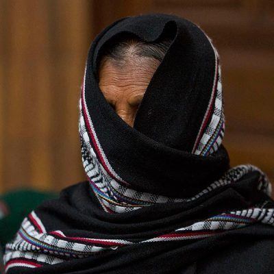 A sexual slavery survivor stands during a break in the Sepur Zarco trial in Guatemala.
